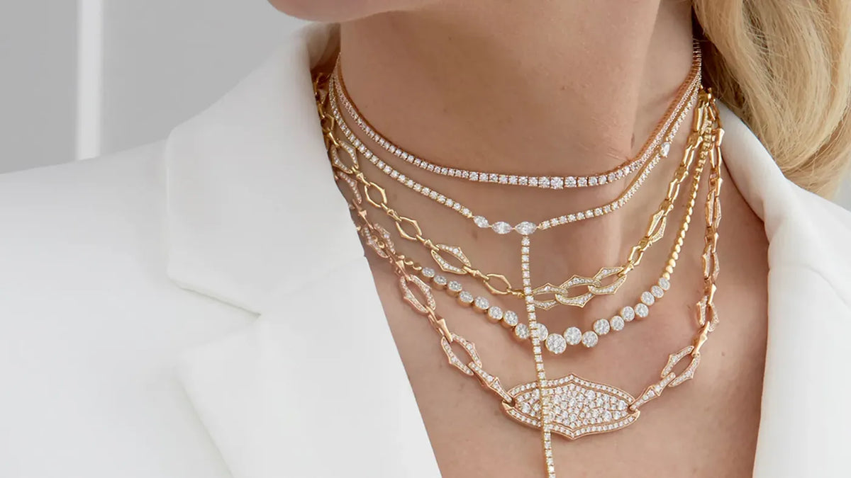 Layered gold and diamond necklaces