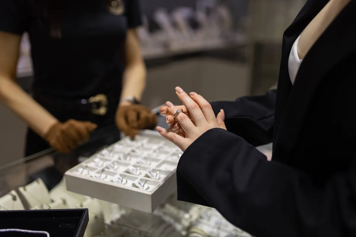 Client trying on rings during a private consultation