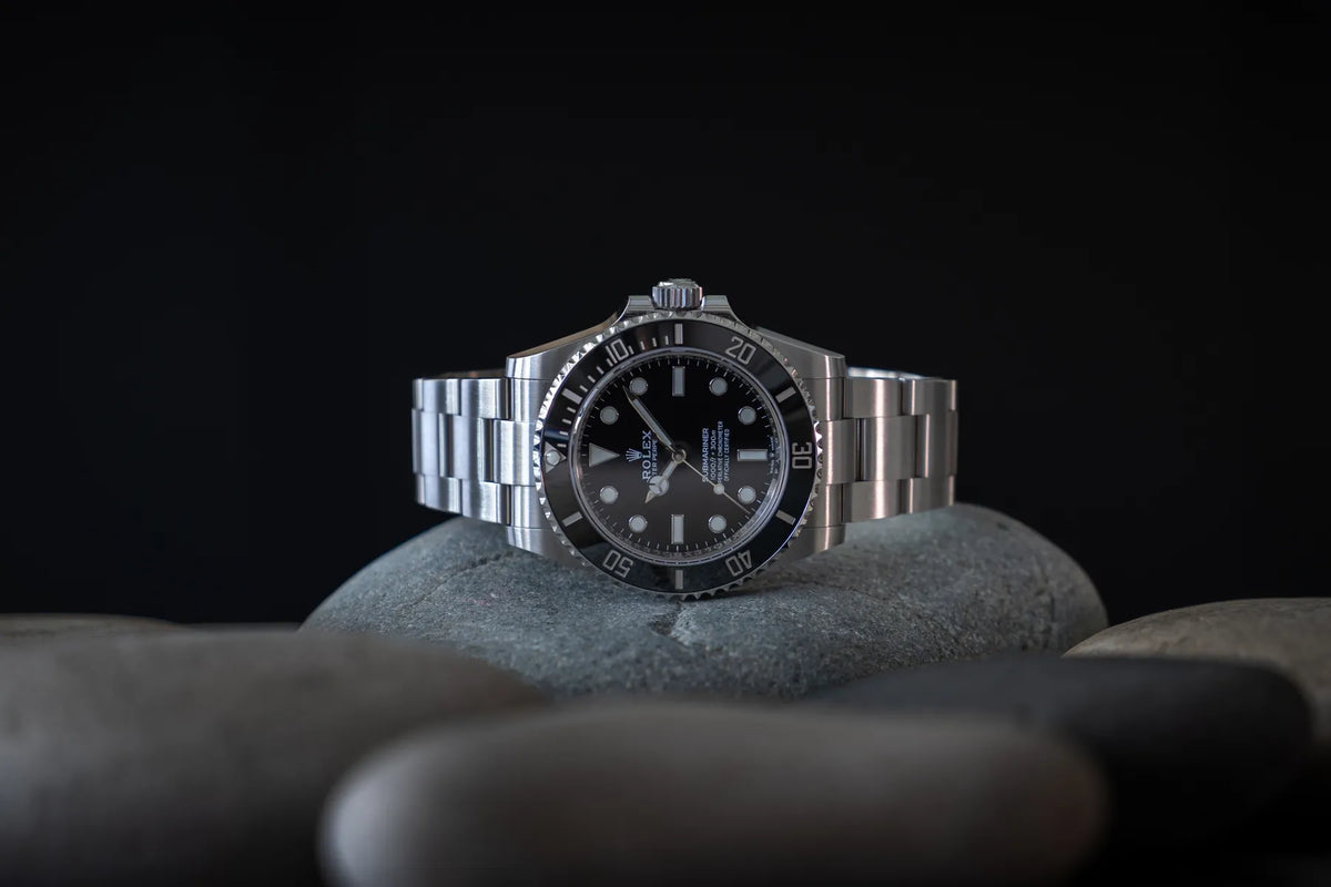Pre-owned Rolex Submariner on a stone